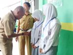 dahnial-kifli-membaca-nama-siswa-smalb_20170410_114609.jpg