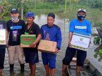 dpd-knpi-kalsel-saat-membagikan-sembako-untuk-korban-banjir-di-kabupaten-banjar-20012021.jpg