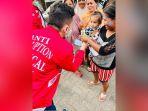 dpw-psi-kalsel-sedang-berbagi-ricebox-dan-susu-kepada-anak.jpg