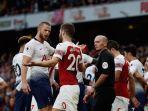 eric-dier-dan-shkodran-mustafi-terlibat-friksi-saat-duel.jpg