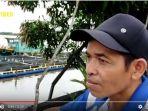 fandi-petani-ikan-nila-menggunakan-jala-apung-sungai-barito.jpg