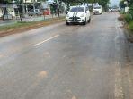 hujan-deras-membuat-kondisi-jalan-sungaiulin-kota-banjarbaru-licin.jpg