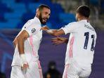 karim-benzema-kiri-merayakan-golnya-bersama-marco-asensio.jpg
