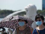 para-pengunjung-mengenakan-masker-pelindung-wajah-di-kawasan-marina-bay.jpg
