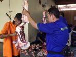 pelaksanaan-penyembelihan-dan-pembagian-daging-hewan-kurban.jpg