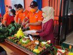 pemotongan-tumpeng-peringatan-hari-jadi-ke-71-provinsi-kalsel-di-kantor-bpdb-14082021.jpg