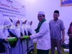 penyerahan-santunan-kepada-anak-yatim-dalam-buka-puasa-bersama-bank-mandiri.jpg