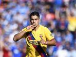 penyerang-barcelona-luis-suarez-berselebrasi-setelah-mencetak-gol-ke-gawang-getafe.jpg