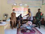 personel-bhabinkamtibmas-polres-tabalong-bantu-pengamanan-penyaluran-blt-dana-desa.jpg