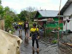 relawan-borneo-rescue-saat-menyisir-kawasan-penduduk-yang-mulai-terendam.jpg