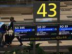 seorang-penumpang-dalam-penerbangan-singapore-airlines-tiba-di-bandara-changi.jpg