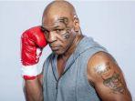tato-arthur-ashe-yang-ada-di-lengan-kiri-mike-tyson.jpg