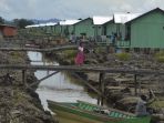 warga-beraktivitas-di-salah-satu-permukiman-transmigrasi-di-kabupaten-bulungan_20170801_145121.jpg