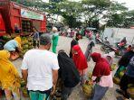 warga-tertib-dalam-antrean-dengan-membawa-tabung-elpiji-3-kg-kosong.jpg