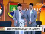 Robinsar-dan-Fajar-saat-debat.jpg