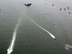 foto-udara-dari-pesawat-cn-295-milik-tni-au-saat-melakukan-proses-pencarian-pesawat-sriwijaya.jpg