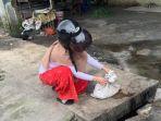 perempuan-melihat-potongan-tubuh-kucing-di-dalam-karung-di-medan.jpg