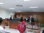 persidangan-pembacaaan-surat-dakwaan-lia-susanti-terdakwa-korupsi-mark-up-pengadaan-masker-covid-19.jpg