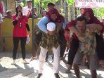 Serunya-lomba-suami-gendong-istri-di-margomulyo-kendal.jpg