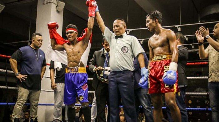 Kanvaskan Lawan 4 Ronde, Petinju Indonesia Ongen Saknosiwi Raih Gelar Juara WBA di Singapura