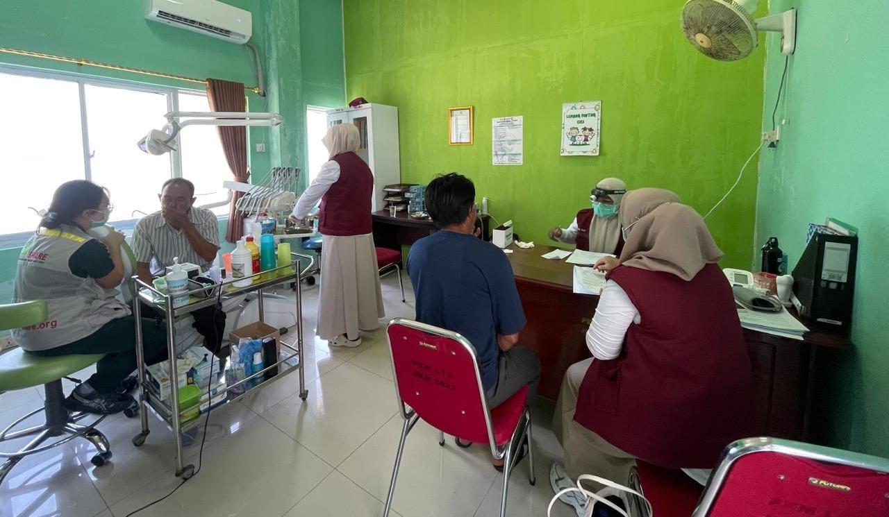 Ardianto Harus Tempuh Perjalanan Laut 1 Jam Untuk Kesempatan Berobat Gratis di Puskesmas Letung - Tribunbatam.id