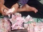 22032021_video-viral-pria-gandakan-uang.jpg