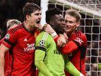 Andre-Onana-tengah-selebrasi-dengan-Harry-Maguire-dan-Scot-McTominay.jpg