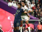 Penyerang-Timnas-Prancis-Kingsley-Coman-berduel-dengan-pemain-tim-Tunisia.jpg