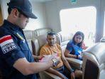 immigration-officer-checks-the-passport-of-two-foreigners.jpg