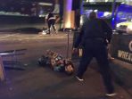 polisi-bersenjata-berdiri-di-dekat-terduga-pelaku-teror_20170604_123505.jpg
