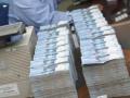 uang-rupiah-ditata-bertumpuk.jpg