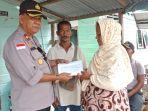wakapolres-kepulauan-anambas-kompol-r-amin-sh-membantu-korban.jpg