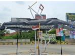 Patung-ikan-gabus-dipajang-di-Jalan-Raya-Gabus-Desa-Srijaya-Tambun-Utara-Bekasi.jpg