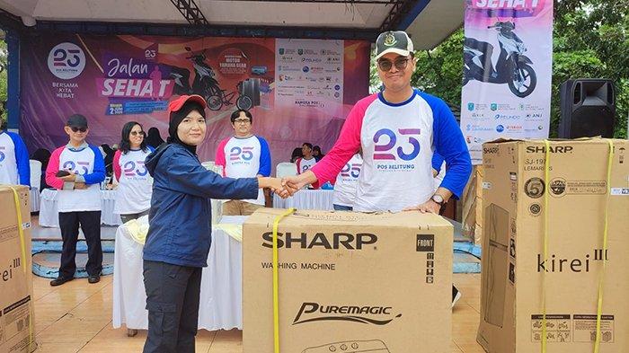 Tedi Warga Pilang Berhasil Dapat Undian Mesin Cuci Jalan Sehat HUT ke-23 Pos Belitung