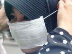 ilustrasi-seorang-warga-di-cianjur-jawa-barat-tengah-mengenakan-masker.jpg