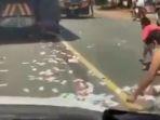 tangkapan-layar-video-uang-tercecer-di-jalan-raya32.jpg
