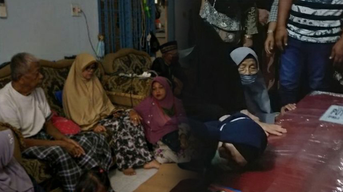 ibu-menangis-sambil-memeluk-peti-jenazah-anaknya.jpg