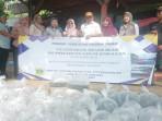 Momen-penebaran-2000-benih-ikan-nila-di-Situ-Tanah-Baru-Desa-Wari.jpg