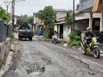 jalan-raya-ciapus-rusak.jpg