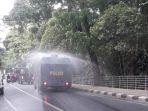 petugas-melakukan-penyemprotan-desinfektan-di-pusat-kota-bogor.jpg