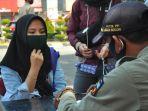 seorang-pengendara-terjaring-razia-masker.jpg