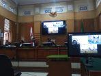 terdakwa-rm-menjalani-sidang-teleconference-di-pengadilan-negeri-bogor-selasa-2142020.jpg
