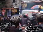 aksi-seorang-polisi-yang-melepaskan-tembakan-peringatan-di-kawasan-kota-bogor.jpg