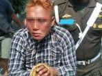 dadang-buaya-saat-diamankan-petugas-koramil-1.jpg