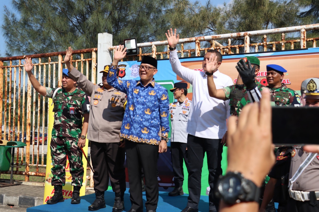 melepaswarga-Kabupaten-Bogor-yang-mengikuti-program-program-mudik-gratis-Polres-Bogor.jpg