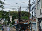 Kabel-listrik-semrawut-di-persimpangan-Jalan-Dewi-Sartika-dan-Jalan-Margonda-Raya.jpg