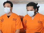 Roby-Satria-alias-Roby-Geisha-dan-asistennya-AJ-di-Mapolres-Jakarta-Selatan-pada-Senin-2132022.jpg