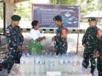 AMANKAN-Satgas-Pamtas-saat-mengamankan-WNA-penyelundup-BBM.jpg