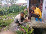 Bripka-Candra-anggota-Polres-Bener-Meriah-sedang-merawat-ODGJ.jpg