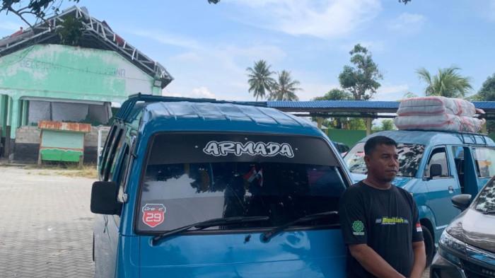 ARUS MUDIK - Suasana arus mudik di Termintal Transit Car Telaga Gorontalo, Senin (16/3/2026) (TribunGorontalo.com/Prayogi Putra Deluhula)